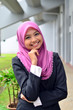 Young asian businesswoman in head scarf smile