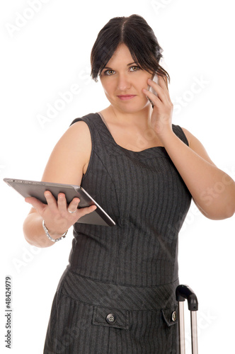 Photo: Business woman with mobile phone and tablet computer Business woman with mobile phone and tablet computer