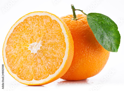 Photo: Orange with leaf on a white background. Orange with leaf on a white background.