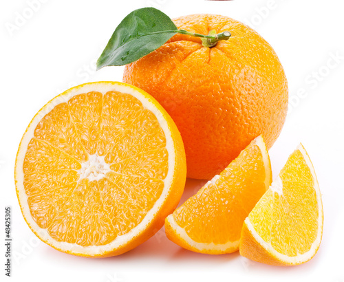 Photo: Orange with leaf on a white background. Orange with leaf on a white background.