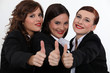 Businesswomen giving the thumb's up