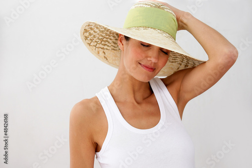 Photo: Brunette wearing straw hat Brunette wearing straw hat