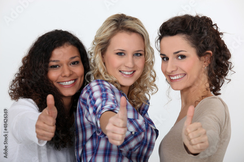 Photo: Three happy girls with thumbs up Three happy girls with thumbs up