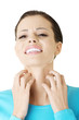 Young beautiful woman scratching her self