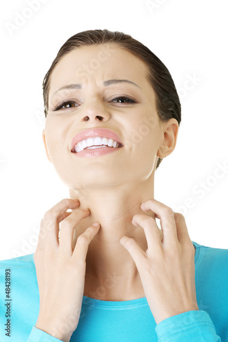 Photo: Young beautiful woman scratching her self Young beautiful woman scratching her self