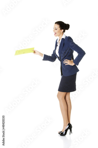 Photo: Happy businesswoman holding portfolio Happy businesswoman holding portfolio