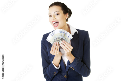 Photo: Happy businesswoman holding euros Happy businesswoman holding euros