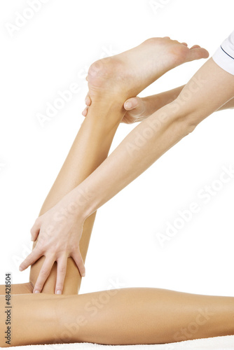 Photo: Physio therapist trying to fix the leg Physio therapist trying to fix the leg