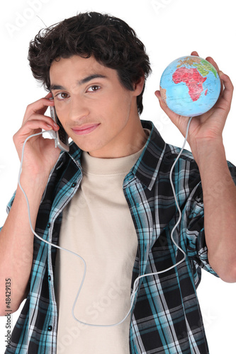 Photo: teen communicating with globe teen communicating with globe