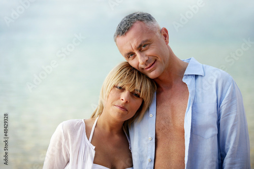 Photo: Couple wearing open shirts outdoors Couple wearing open shirts outdoors