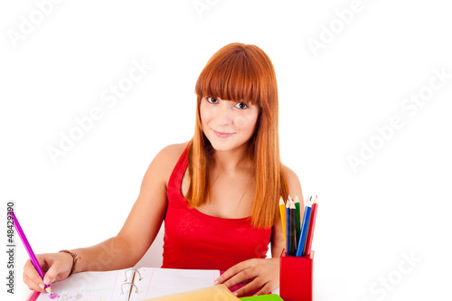 Photo: University girl holding a school bag and smiling University girl holding a school bag and smiling