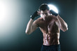 Young muscular sports guy with boxing