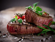 Grilled bbq steaks with fresh herbs and tomatoes
