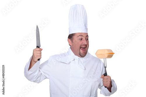 Photo: Angry chef attacking fast-food packaging Angry chef attacking fast-food packaging