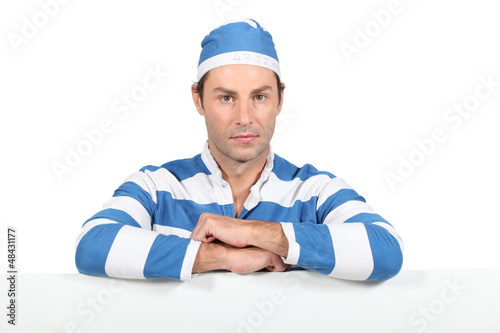 Photo: Man in prisoner outfit Man in prisoner outfit