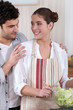 Couple mixing salad