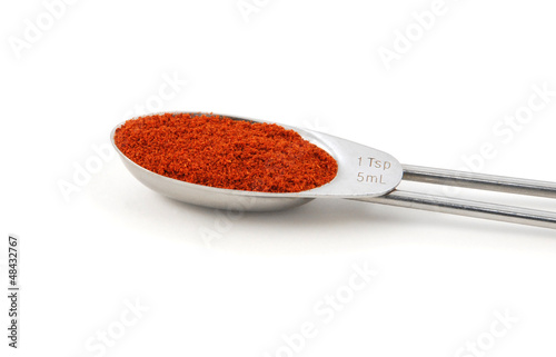 Photo: Chilli powder measured in a metal teaspoon Chilli powder measured in a metal teaspoon