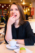 Photo: woman is eating dessert woman is eating dessert