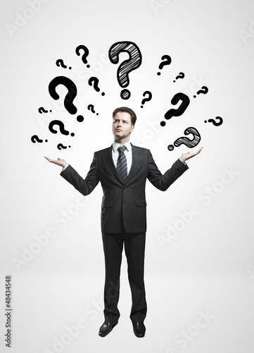 Photo: man and questions mark man and questions mark