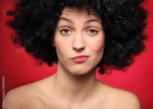 Photo: Young woman being suspicious Young woman being suspicious