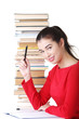 Happy smiling young student woman with books