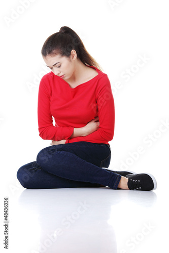 Photo: Young woman with stomach issues Young woman with stomach issues