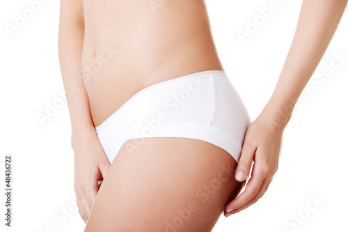 Photo: Slim tanned woman's body. Slim tanned woman's body.