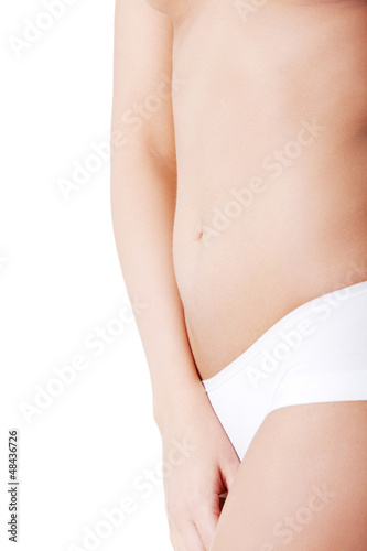 Photo: Beautiful female body isolated on white. Beautiful female body isolated on white.