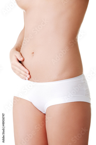 Photo: Beautiful female body isolated on white. Beautiful female body isolated on white.
