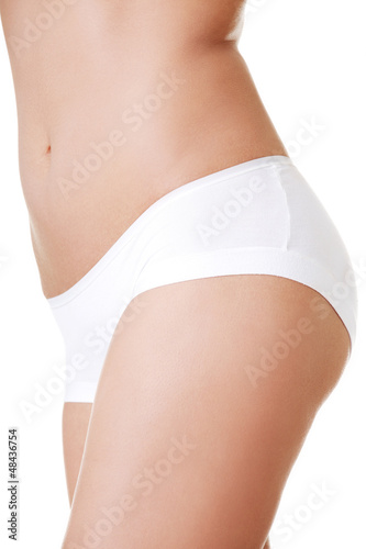 Photo: Beautiful female body isolated on white. Beautiful female body isolated on white.