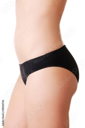 Photo: Slim tanned woman's body. Slim tanned woman's body.