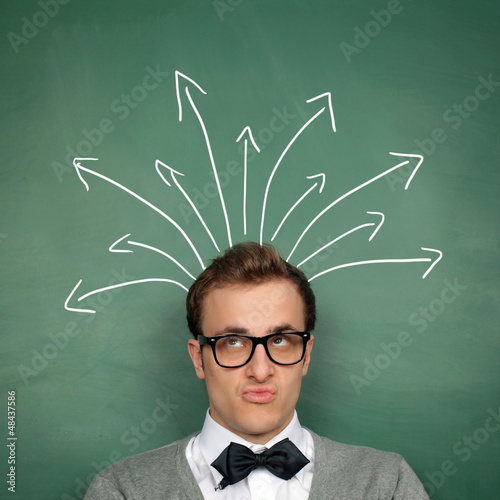 Photo: Man at the Blackboard with Decisions Man at the Blackboard with Decisions