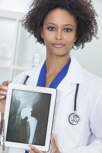 Photo: African American Woman Doctor X-Ray Tablet Computer African American Woman Doctor X-Ray Tablet Computer