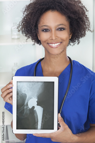 Photo: African American Woman Doctor X-Ray Tablet Computer African American Woman Doctor X-Ray Tablet Computer