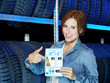 Female customer presenting EU tire labeling in a garage
