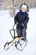 Little Boy With Sled In Winter