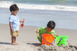 Young Hispanic Boys Children Brothers Playing Beach