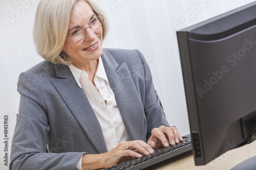 Photo: Senior Woman Using Computer Senior Woman Using Computer