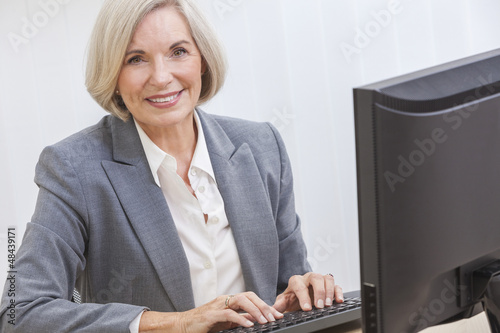 Photo: Senior Woman Using Computer Senior Woman Using Computer