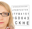 Woman with glasses and eye test panel