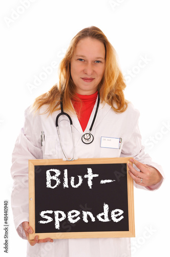 Photo: Ärztin mit Schild - Blutspende Ärztin mit Schild - Blutspende