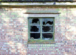 Smashed panes of glass in a window