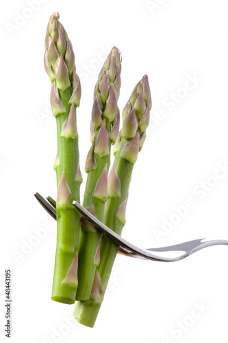 Photo: asparagus on a fork isolated asparagus on a fork isolated