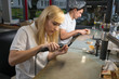 Dental technician polishing gold tooth