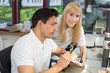 Apprentice in a dental lab watching a technician work