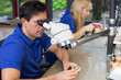 Dental technicians with microscope at work