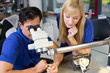 Dental technicians working on microscope