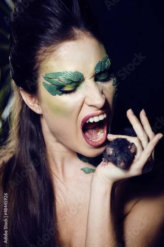 Photo: woman snake with rat woman snake with rat