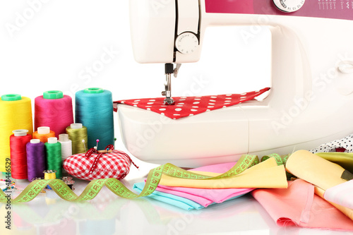 Photo: sewing machine and fabric isolated on white sewing machine and fabric isolated on white