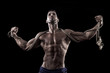 muscled man on a black background